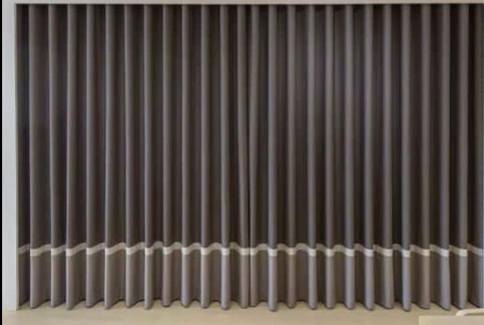 Modern majlis design Saudi Arabia — contemporary seating with premium fabric curtains