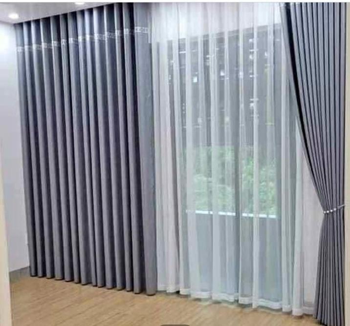 Dark pleated luxury curtains — curtain installation Riyadh for upscale interiors